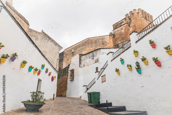 Fototapeta a cobbled street with typical white houses in Arcos de la Frontera, province of Cádiz, Andalusia, Spain