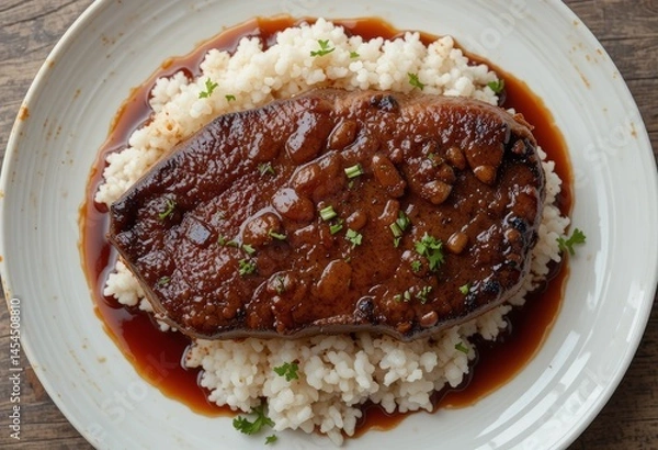 Fototapeta Pan-roasted ribeye in teriyaki sauce, rice.