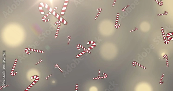 Obraz Image of snow and christmas candy canes falling over spot lights in background