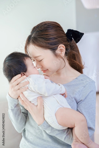 Obraz 赤ちゃんを抱いて祈るような表情の女性