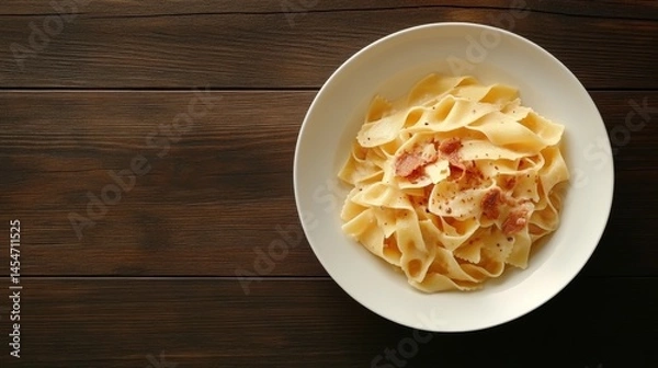 Obraz Delicious homemade pasta dish with bacon rustic kitchen setting food photography close-up view culinary delight