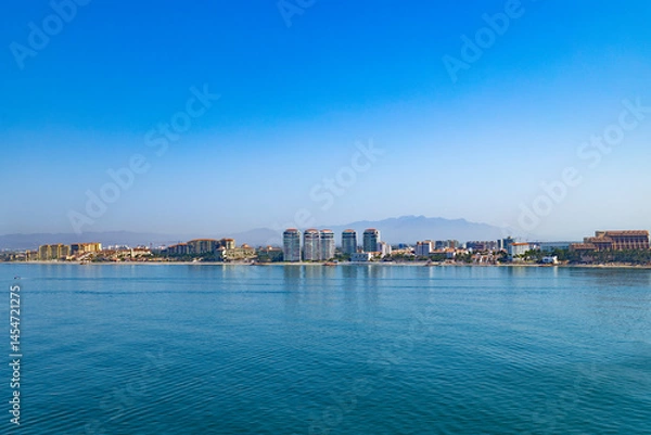 Fototapeta Horizontal view of the Puerto Vallarta, Mexico coastline and hotel row. Beautiful scenic view of this tourist destination.