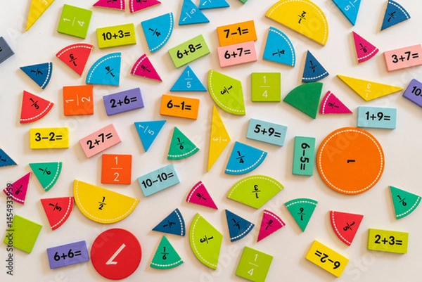 Fototapeta Colorful educational math manipulatives arranged on a white surface, promoting learning through hands-on activities and visual engagement. education,  back to school