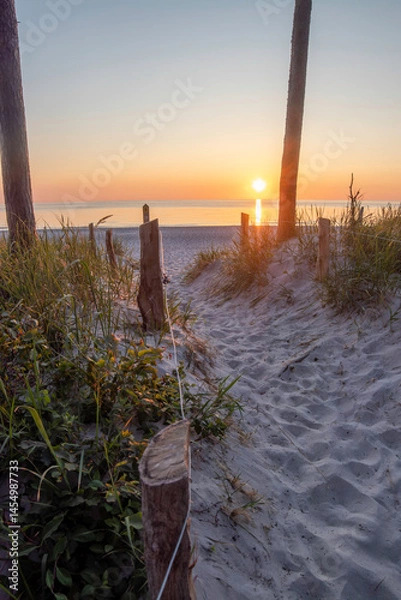 Obraz Sunset over the Baltic Sea at Darß Peninsula in Germany creates a serene coastal atmosphere