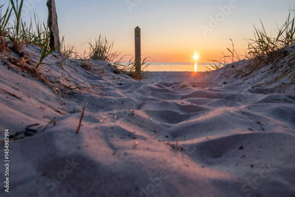 Obraz Sunset over Baltic Sea at Darß Peninsula in Germany reveals stunning colors and tranquil atmosphere