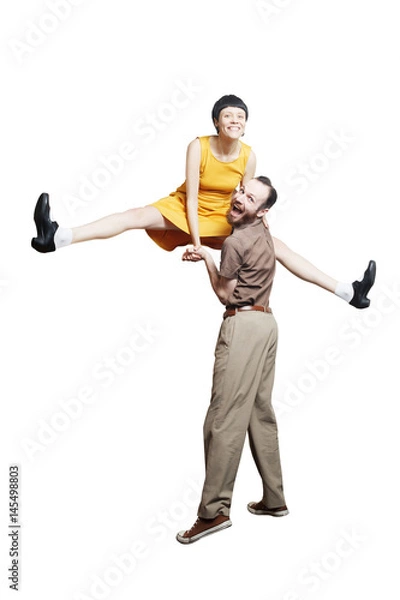 Fototapeta Rock'n'roll dance boogie woogie. Boogie acrobatic stunt in a studio background. Dance for rock-n-roll music.