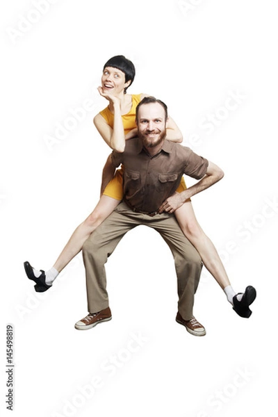 Fototapeta Rock'n'roll dance boogie woogie. Boogie acrobatic stunt in a studio background. Dance for rock-n-roll music.