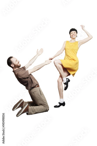 Fototapeta Rock'n'roll dance boogie woogie. Boogie acrobatic stunt in a studio background. Dance for rock-n-roll music.
