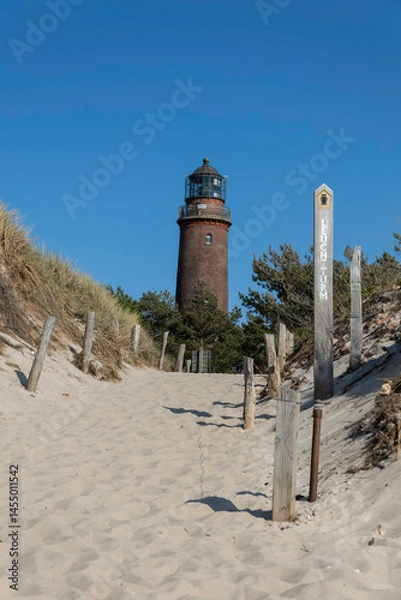 Obraz Explore the scenic paths leading to Darßer Ort Lighthouse near the German Baltic Sea shore