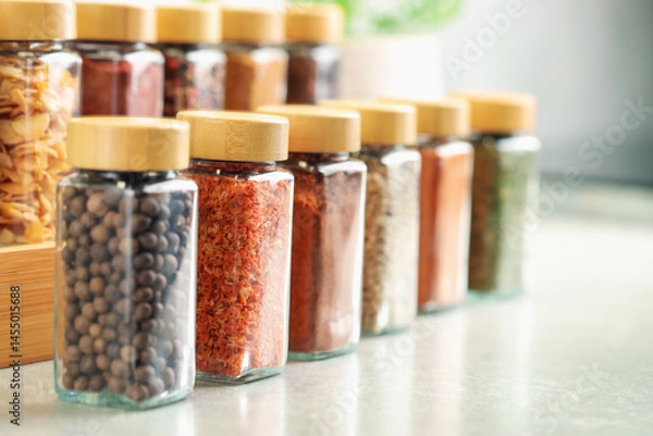 Obraz Many different aromatic spices in jars on table indoors, closeup