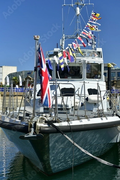 Fototapeta Jersey, U.K. May 4th 2025. A British Naval patrol launch vessel and part of the Jersey 2025 Boat show event.