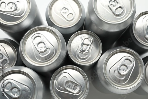 Fototapeta Many different tin cans on light background, top view