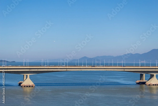Obraz ponte Pedro Ivo e Colombo Salles  em um dia de sol Florianópolis Santa Catarina Brasil e um avião