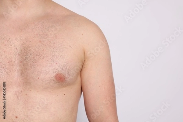 Obraz Man standing on light background, closeup. Space for text