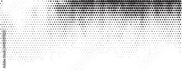 Fototapeta A dynamic black-and-white gradient transitions from densely packed dots to a sparse scattering effect.