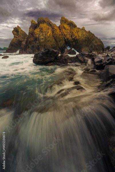 Fototapeta rocky coast at sunset in Kiluan Lampung Indonesia