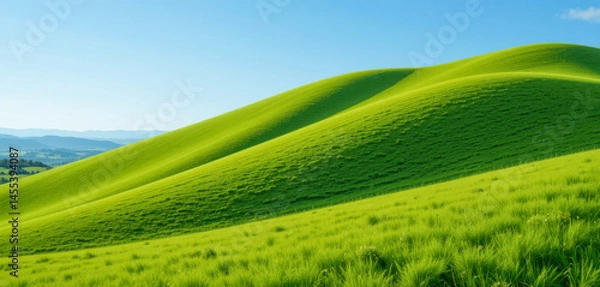 Obraz Sun-drenched, vibrant green hills gently roll under a clear blue sky.  The landscape is peaceful and evokes a sense of serenity and natural beauty.