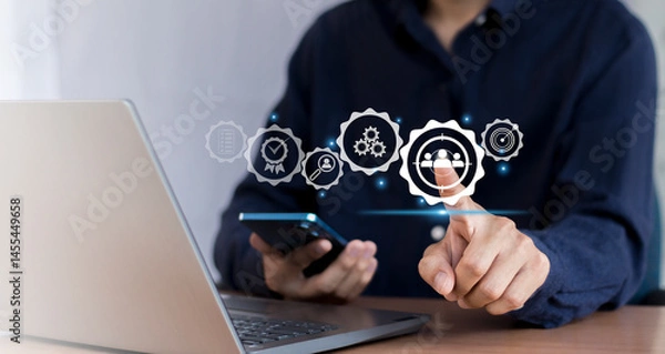 Fototapeta Business marketing position concept, businessman holds dart board icon with arrows for customer target group.	