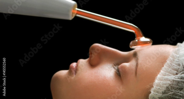 Obraz Beauty treatment of face skin with high frequency infrared spot remover in SPA center