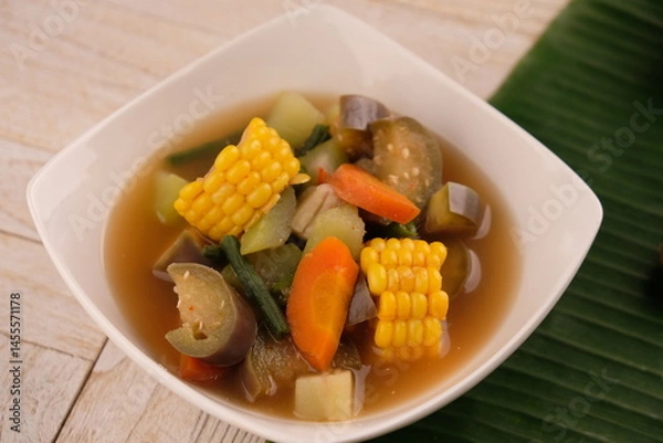 Fototapeta Sayur asem. Sayur asam is a type of sour vegetable dish typical of Indonesia. served on a ceramic bowl.