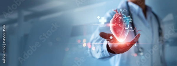 Obraz Heart disease and vascular disorder preventive concept. Cardiologist doctor hold colorful heart and examine patient heart functions. Medical technology and hospital care treatment.