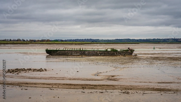 Fototapeta A shipwreck on the banks of The Swale near St Giles, Kent, England
