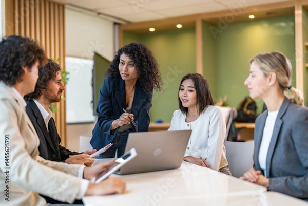 Fototapeta Leadership training, executive communication and team development in progress with diverse professionals in coaching seminar, strategic thinking and interpersonal skills in a modern workplace