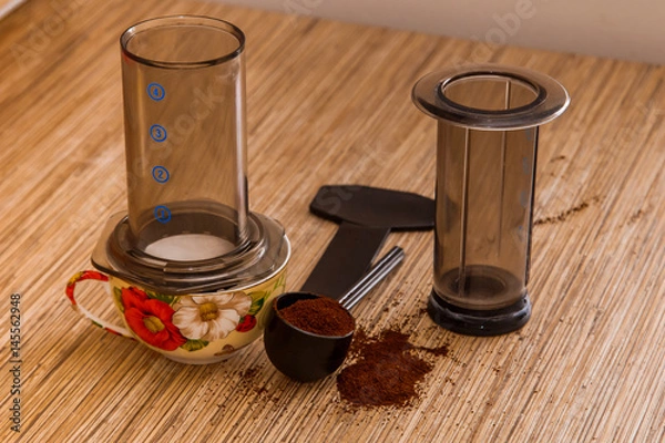 Obraz Preparation of ground coffee in aeropress - portable filter coffee maker