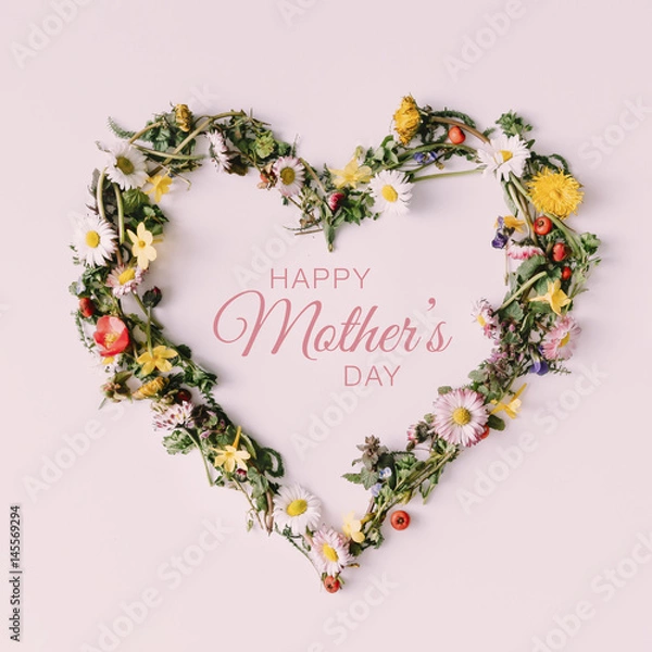 Fototapeta Heart of nature with happy Mothers day text. Love concept. Flat lay.