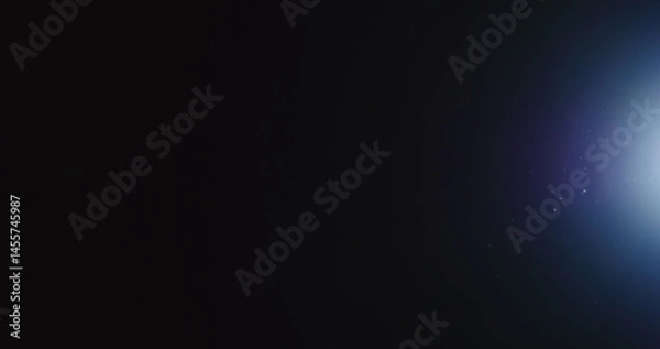 Obraz natural dust particles float in air on black background