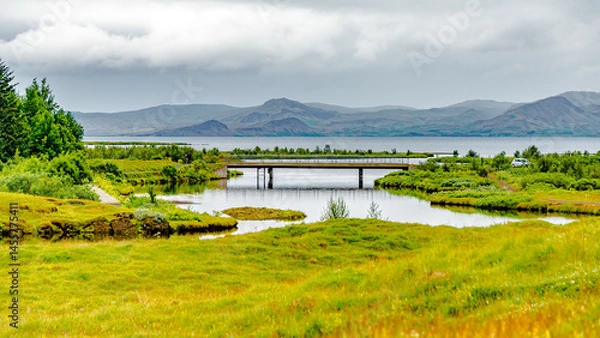 Fototapeta Thingvellir National Park, Iceland, Famous geological and historical site with a river stream and lake, summer, South West Iceland, scenic dramatic view