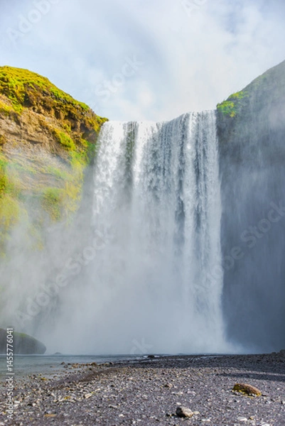 Fototapeta Cover page with Skogafoss waterfall, Iceland, closeup, powerful and famous fall without people, summer, South Iceland, scenic dramatic view