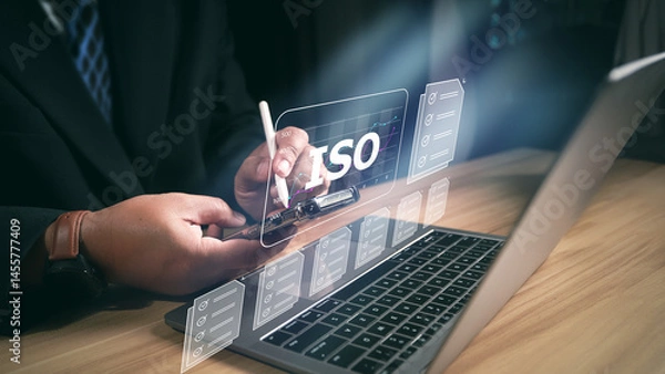 Fototapeta ISO standards quality control, assurance and warranty business technology concept. Businessman using laptop computer with quality assurance and document icon for ISO, ISO concept.