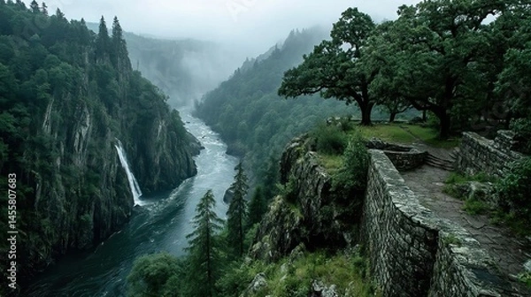 Fototapeta A dramatic waterfall plunging into a deep gorge, the mist rising from the churning water below.