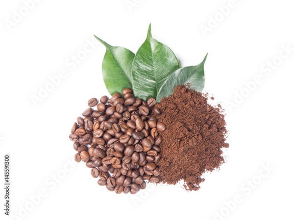 Obraz Pile of ground and coffee beans with green leaves from top view