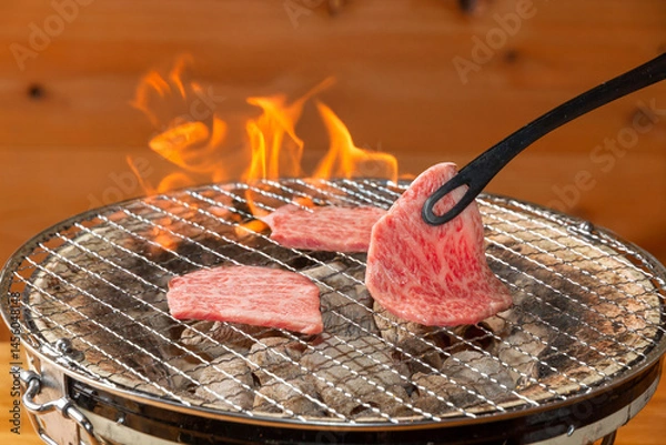 Fototapeta 肉を焼く