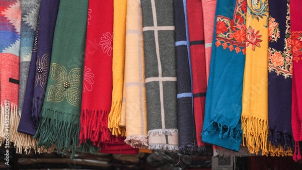 Obraz Colorful cashmere cloths with traditional Nepali and Indian patterns are sold in the market shop.