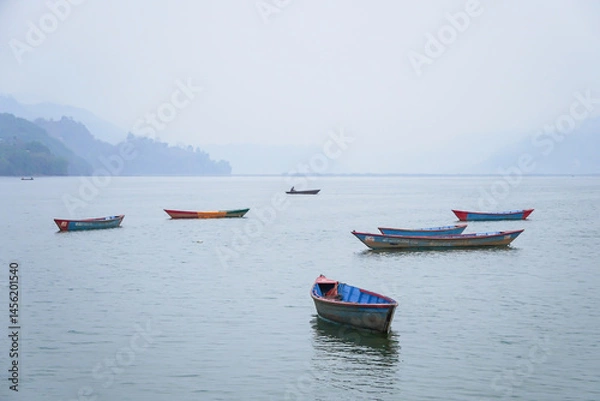 Obraz Many traditional boats are docking at Phewa Lake or Phewa Tal in the morning.