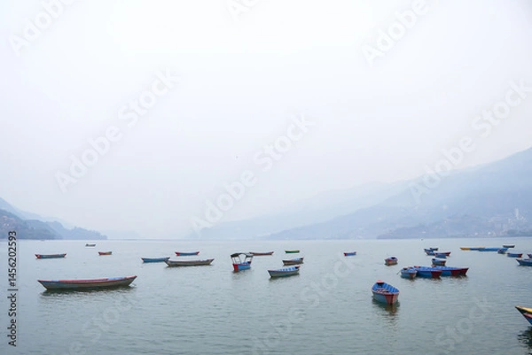 Obraz Many traditional boats are docking at Phewa Lake or Phewa Tal in the morning.