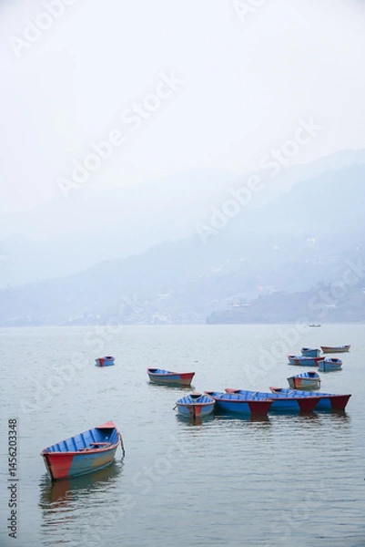 Obraz Many traditional boats are docking at Phewa Lake or Phewa Tal in the morning.