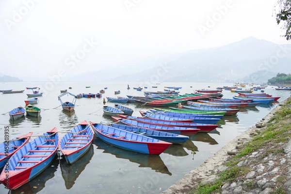 Obraz Many traditional boats are docking at Phewa Lake or Phewa Tal in the morning.