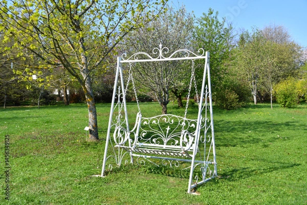 Fototapeta Elegant swing bench in vintage style in the garden