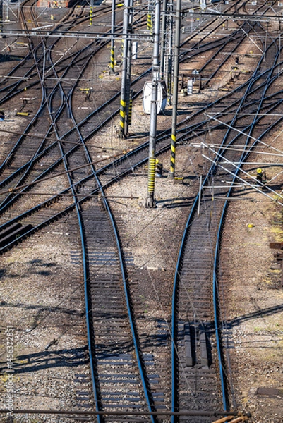 Fototapeta A view of the of railway tracks, switches and signals.