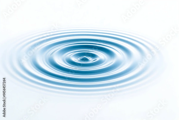Fototapeta Ripples on tranquil water surface reflecting light.