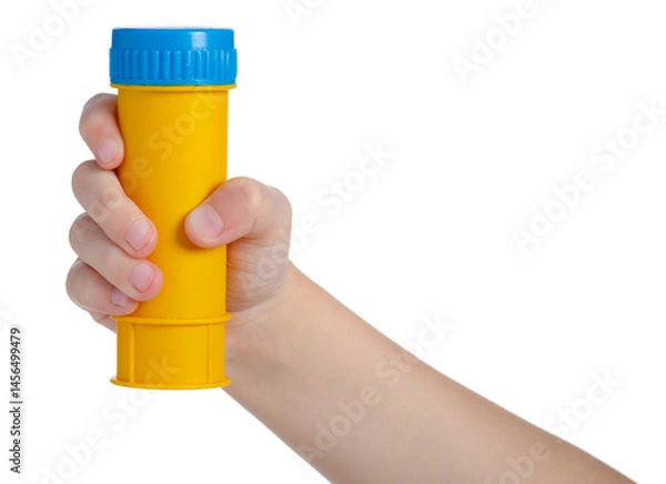 Obraz Plastic yellow bottle of soap bubbles in hand isolated on white background