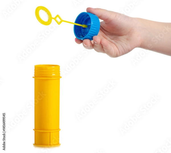 Obraz Plastic yellow bottle of soap bubbles in hand isolated on white background