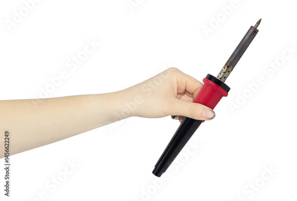 Obraz old soldering iron in hand, outstretched hand with  soldering iron isolated from background