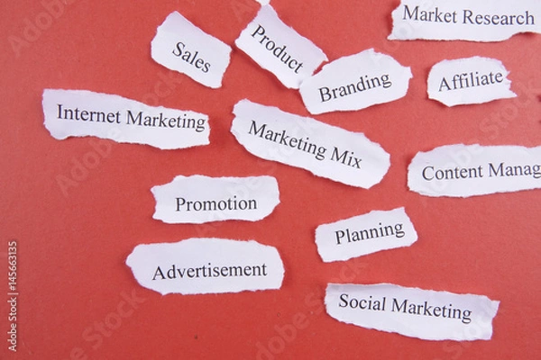 Fototapeta Marketing conceptual word on torn paper.