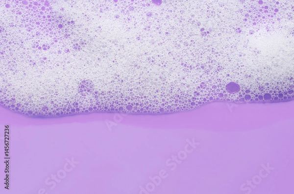 Fototapeta Texture of white foam. Cleansing mousse for the face or bath foam or washing powder. Copy space