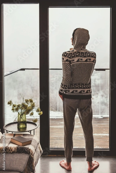 Fototapeta Man Enjoying Winter Scenery outside Window